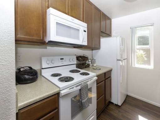 White Appliances in Kitchen at Eucalyptus Grove Apartments, Chula Vista, CA, 91910